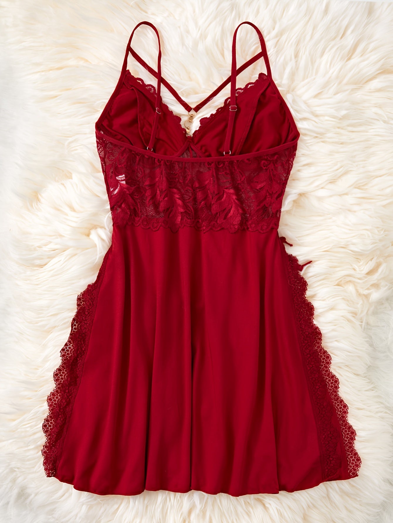 Chic lace nightgown with strappy backless design and metal accents, perfect for women's sleepwear.