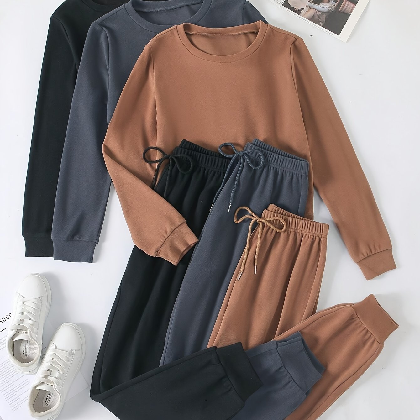 Cozy 3-piece women's loungewear set for fall with long sleeve top and jogger pants.