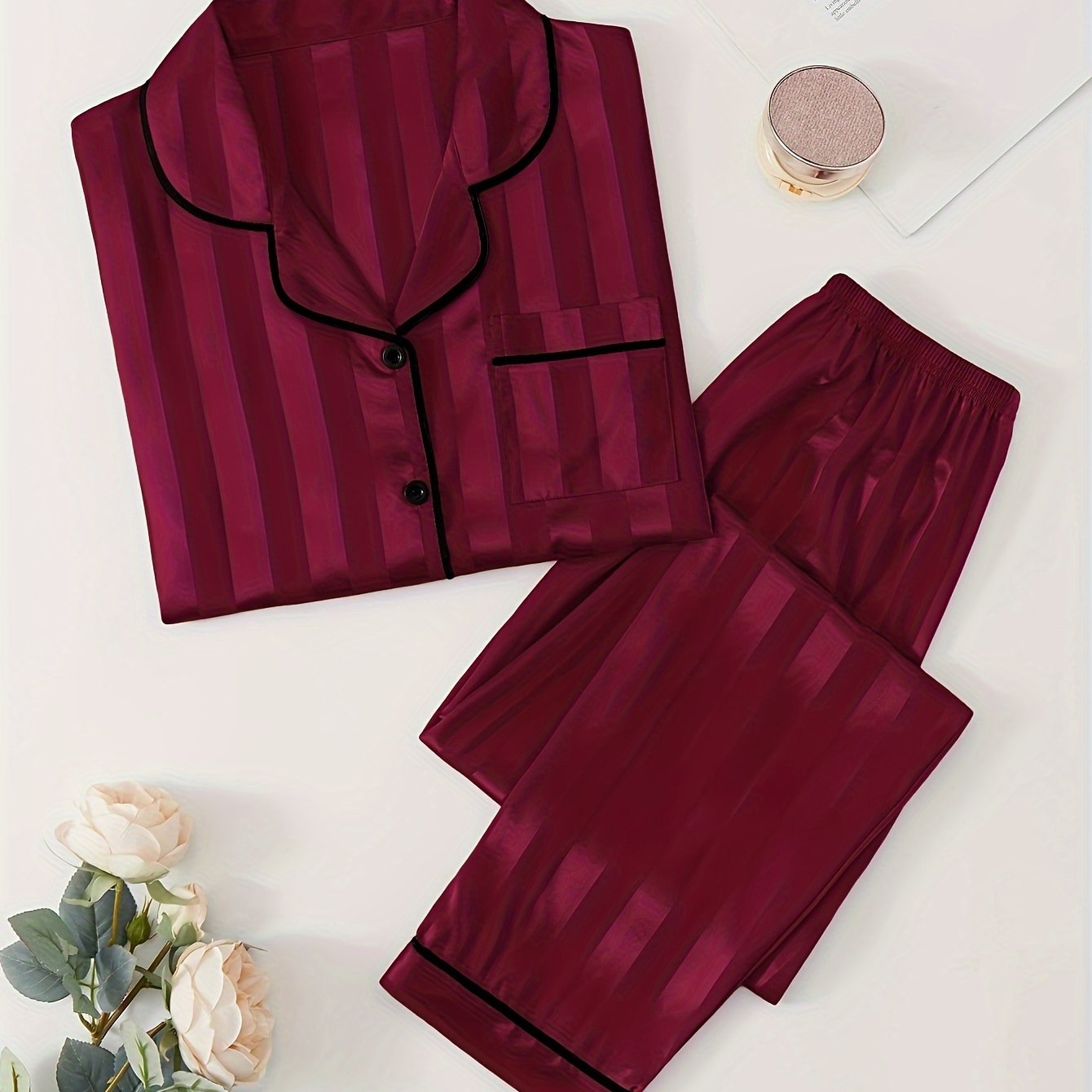 Women's satin pajama set with striped long sleeve top and lounge pants for sleepwear and loungewear.