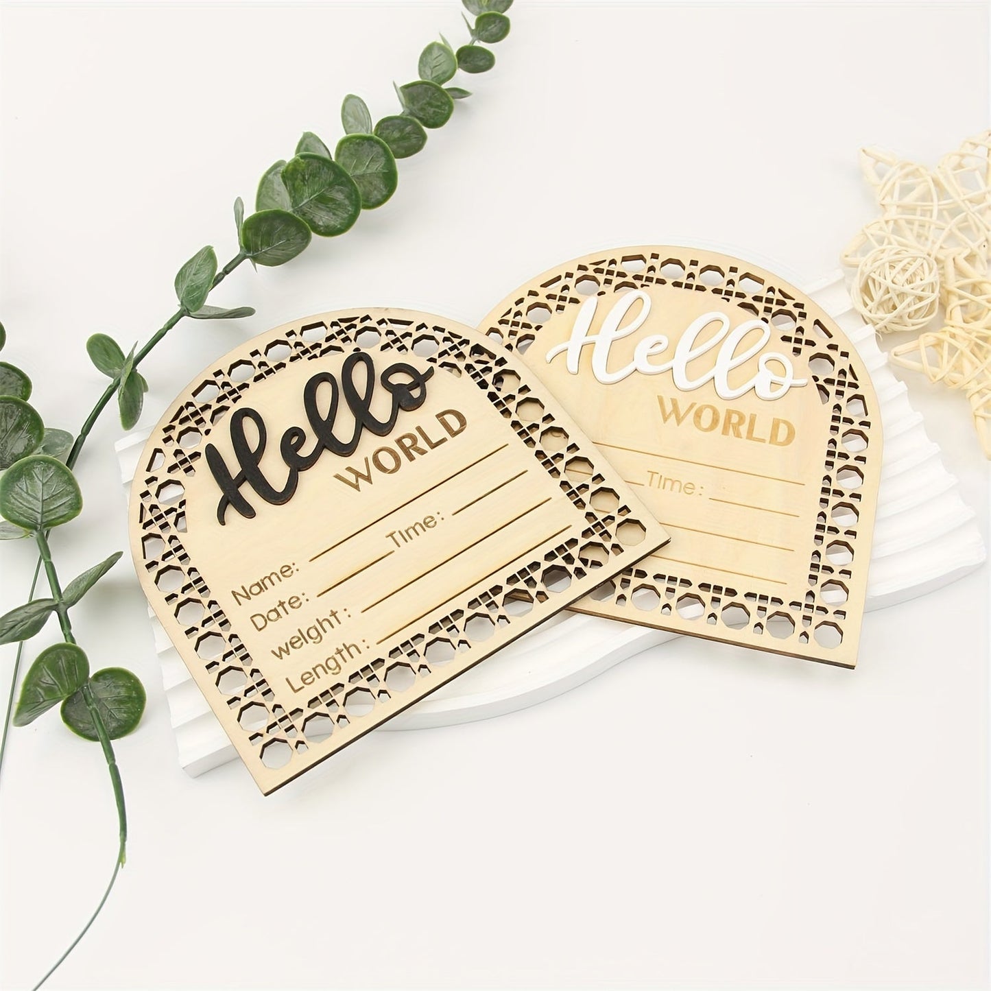 Wooden birth announcement plaque in fan-shaped design, featuring "Hello World" message. Perfect for photo props, this engraved keepsake plaque measures 13.97cm and includes fields for birth details. In a beautiful apricot color, this plaque is suitable