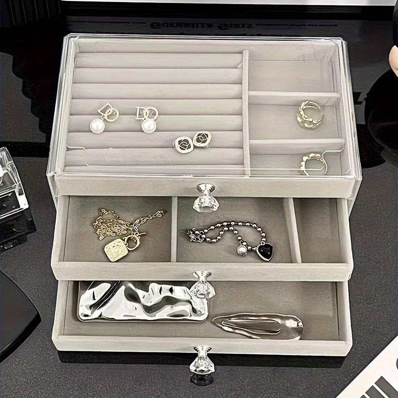 1 large drawer jewelry box with 3 layers for storing earrings, rings, necklaces, bracelets, and pendants on a desktop.