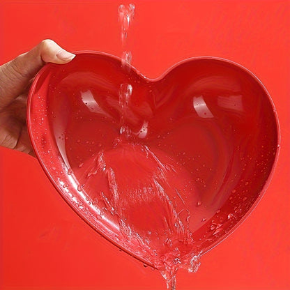 Heart-shaped plastic serving saucers in red for special occasions.