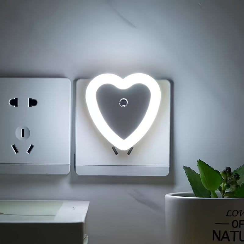 Heart-shaped LED night light with built-in sensor and European plug for indoor use. Ideal for stairways, bedrooms, kitchens, and hallways. Not waterproof. Can be wall-mounted.