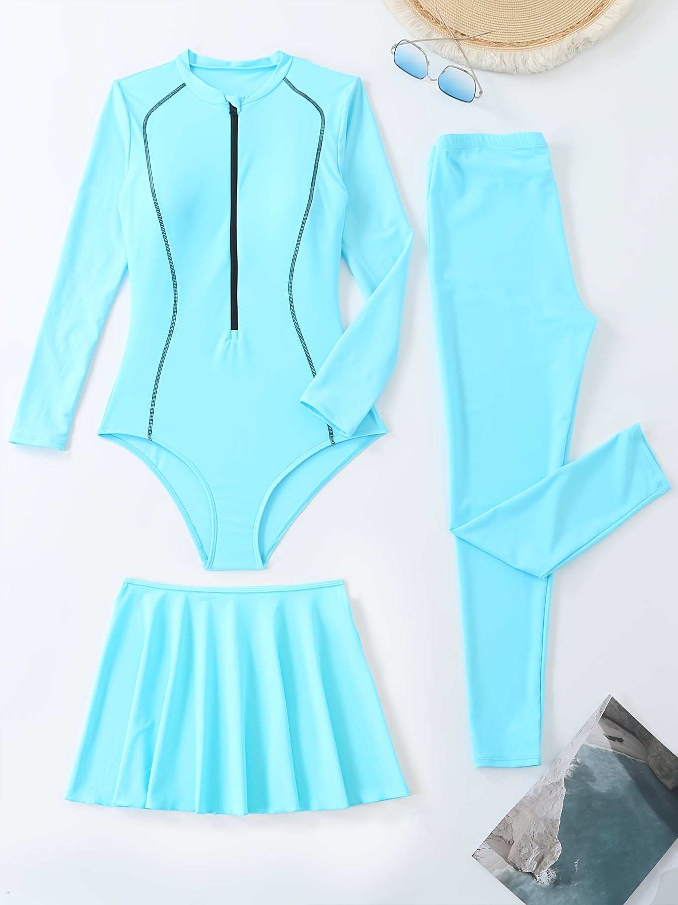 Sporty one-piece swimsuit with full coverage, long sleeves, high-waist skirt, and slimming design.