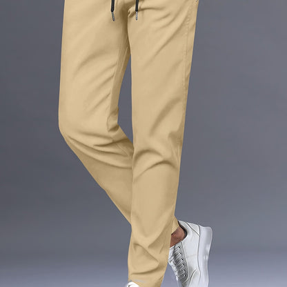 Stylish men's solid pants with pockets, casual and breathable drawstring trousers for outdoor activities.