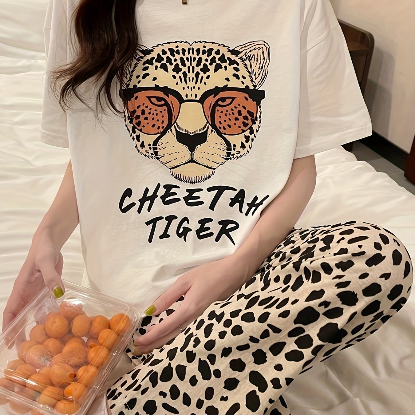 Casual pajama set for women with leopard and letter print, featuring a short sleeve top and matching pants for a comfortable fit.