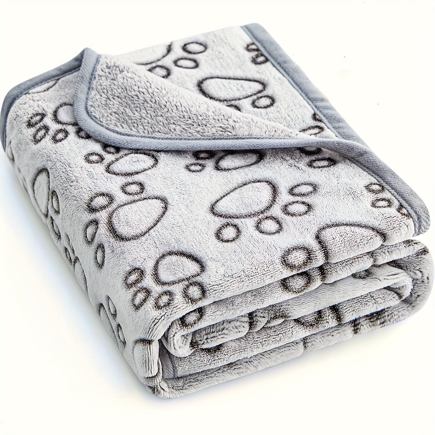 Ultra-soft paw print fleece pet blanket for dogs and cats, cozy, warm, stain-resistant, machine washable. Ideal for small to large breeds with an adorable animal paw design in gray.