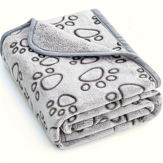 Ultra-soft paw print fleece pet blanket for dogs and cats, cozy, warm, stain-resistant, machine washable. Ideal for small to large breeds with an adorable animal paw design in gray.