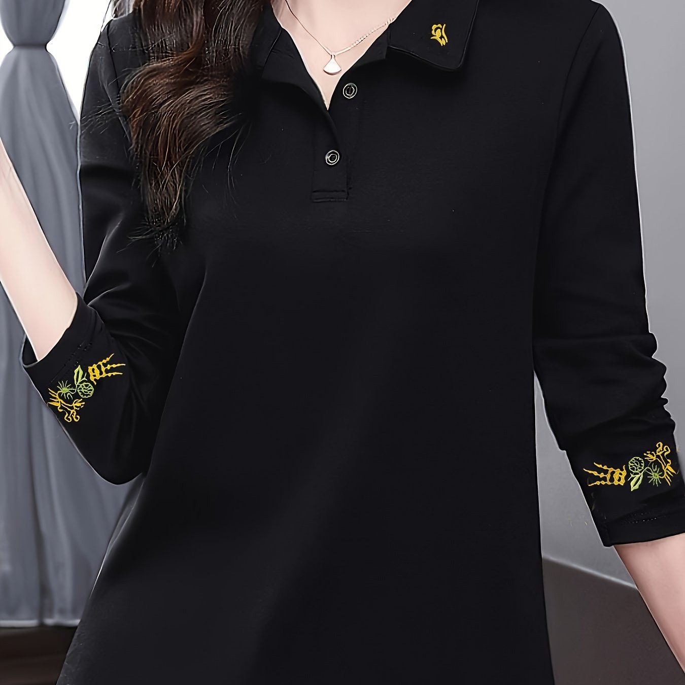 Women's stylish black long sleeve shirt with floral details - soft, comfortable, and breathable for casual wear in spring/fall.