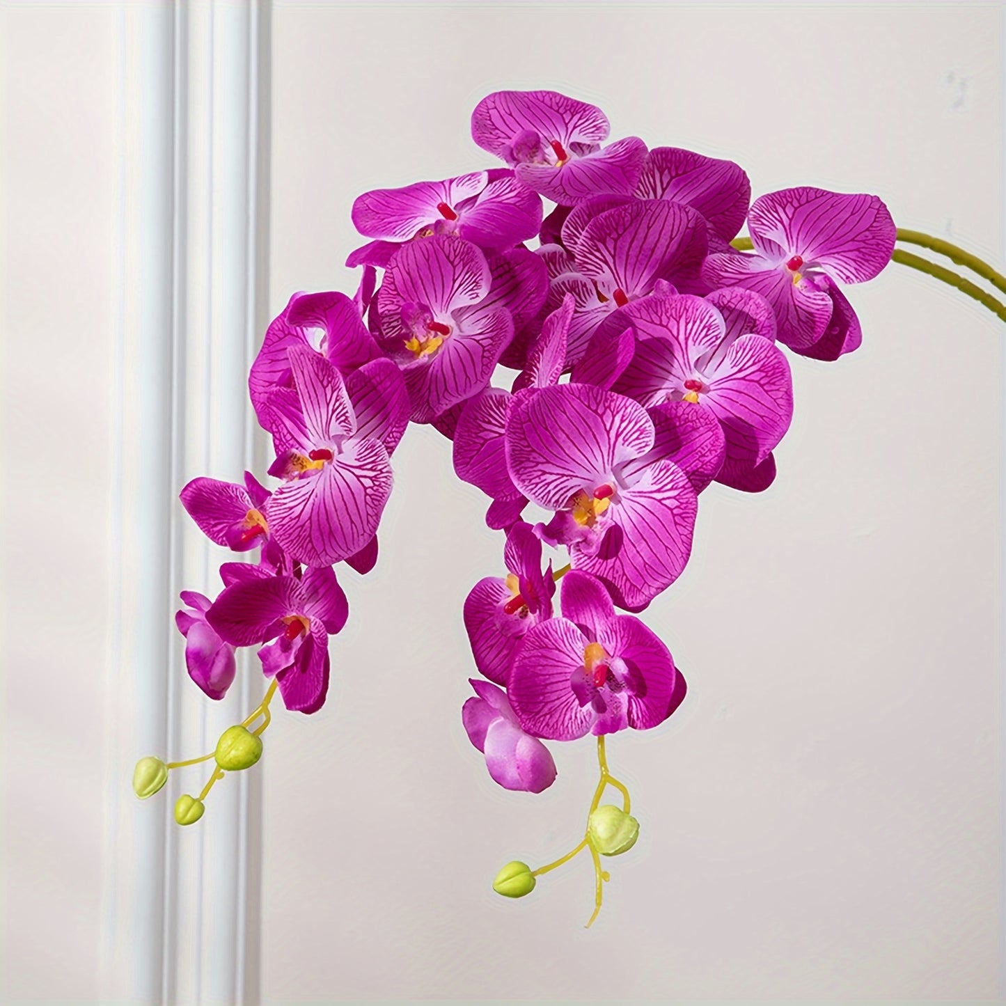 68.58cm vibrant purple red latex orchid with long stem. Perfect for weddings, home decor, and parties. Ideal for high vases, tabletops, and seasonal displays. Great decorative accessory.