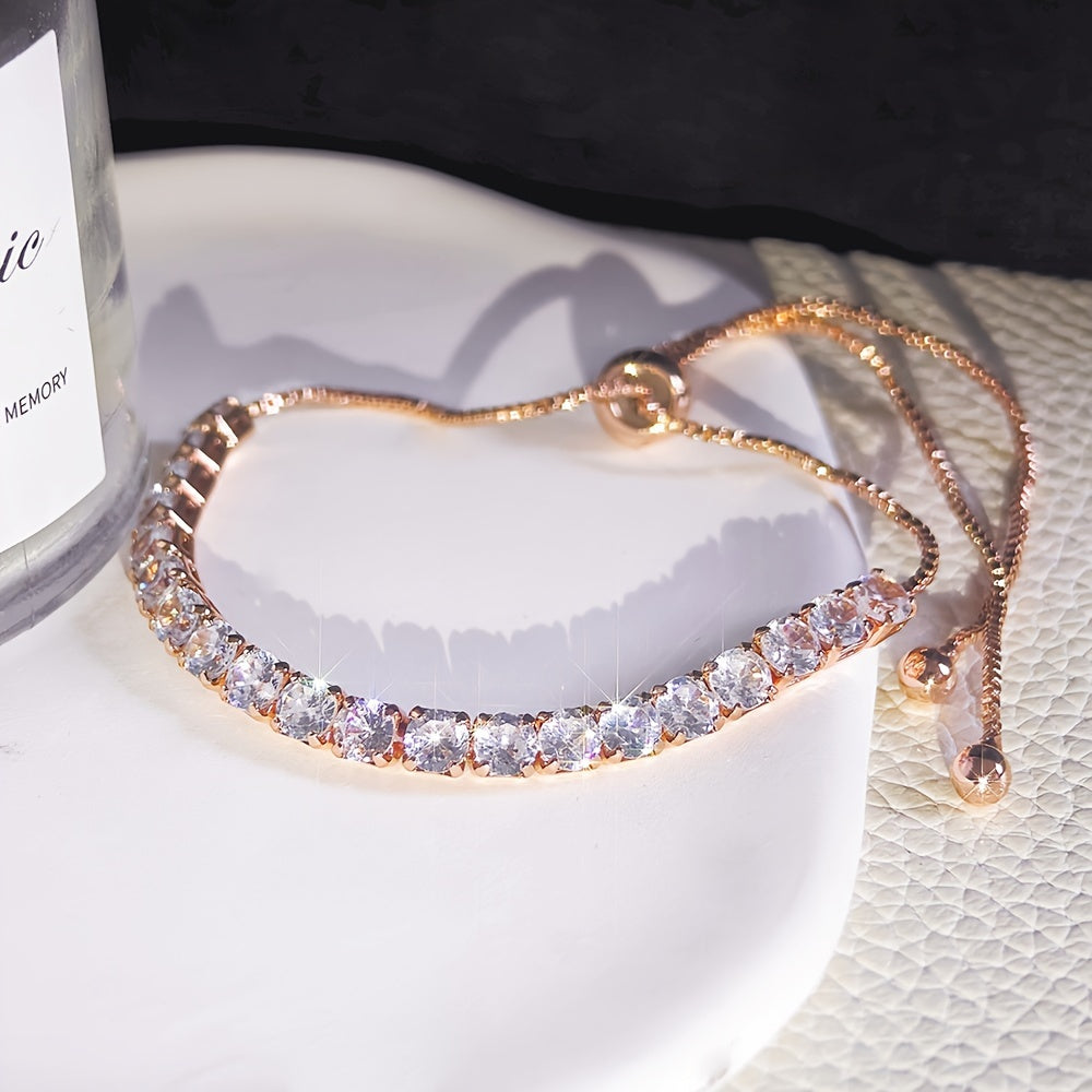 Stylish vintage-inspired cubic zirconia tennis bracelet with adjustable copper chain and sparkling rhinestones, ideal for parties or casual wear, great Valentine's Day gift.