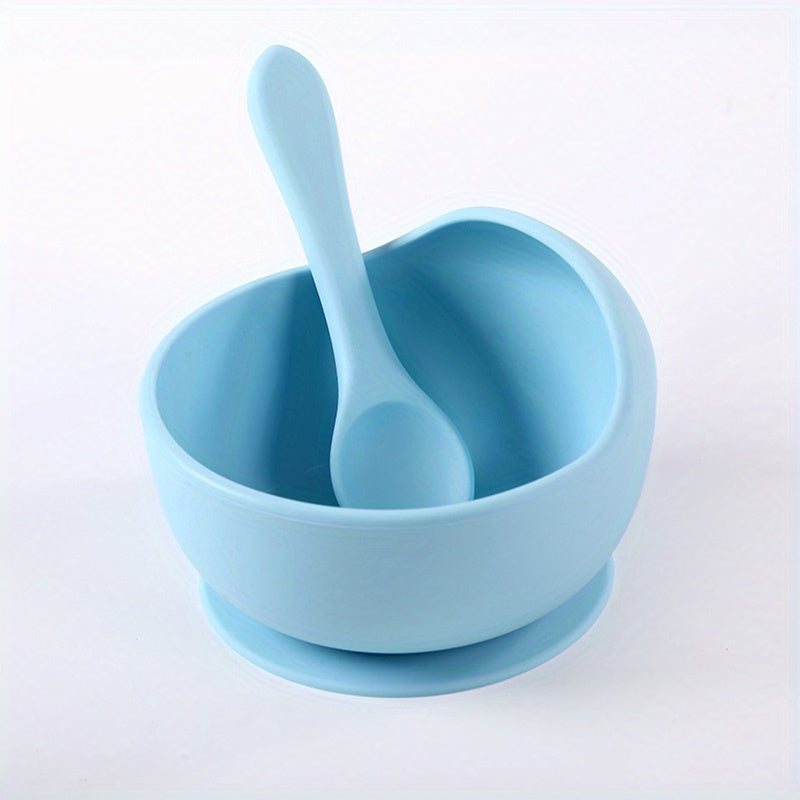 1 set of 2 pieces silicone bowl and spoon for children, featuring a suction cup for anti-slip use. This set is perfect for serving complementary foods and training little ones to eat independently. The set also includes a silicone straw for added