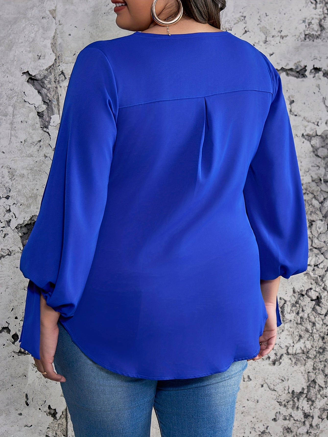 Elegant plus size royal blue satin blouse with tie sleeves, round neck, and smooth texture. Perfect for spring, summer, and fall.