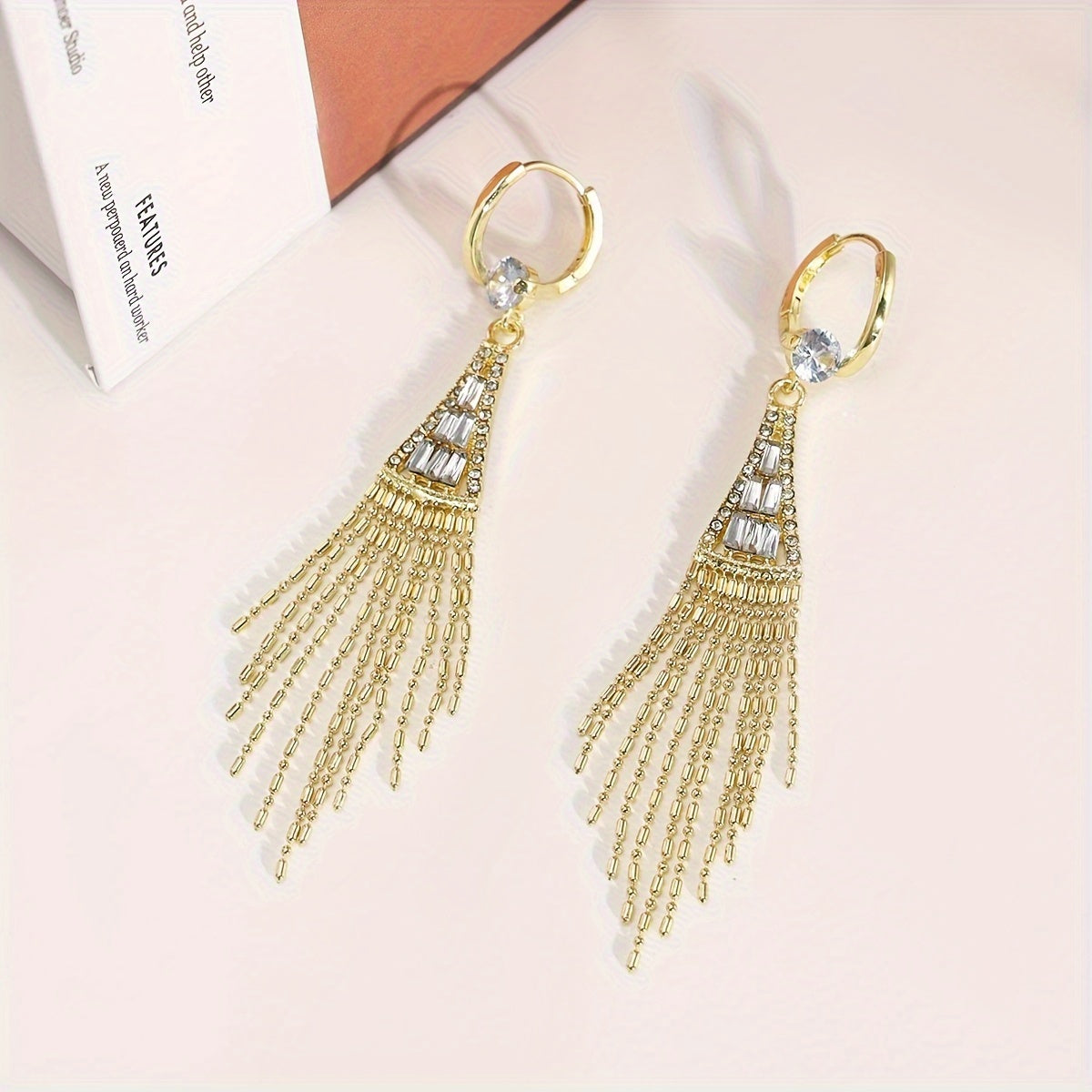 Elegant tassel earrings with sparkling zirconia, perfect for everyday wear or special occasions. Add a touch of glamour to your casual outfits or date night look.