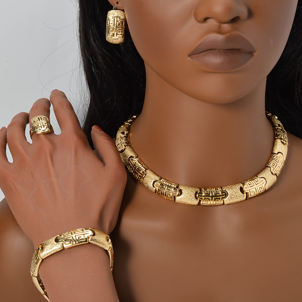 Experience the glamour of our Women's copper jewelry set, featuring a textured and frosted design that exudes sophistication. This stunning four-piece set includes a necklace, bracelet, ring, and earrings all in a dazzling Golden hue. Each piece