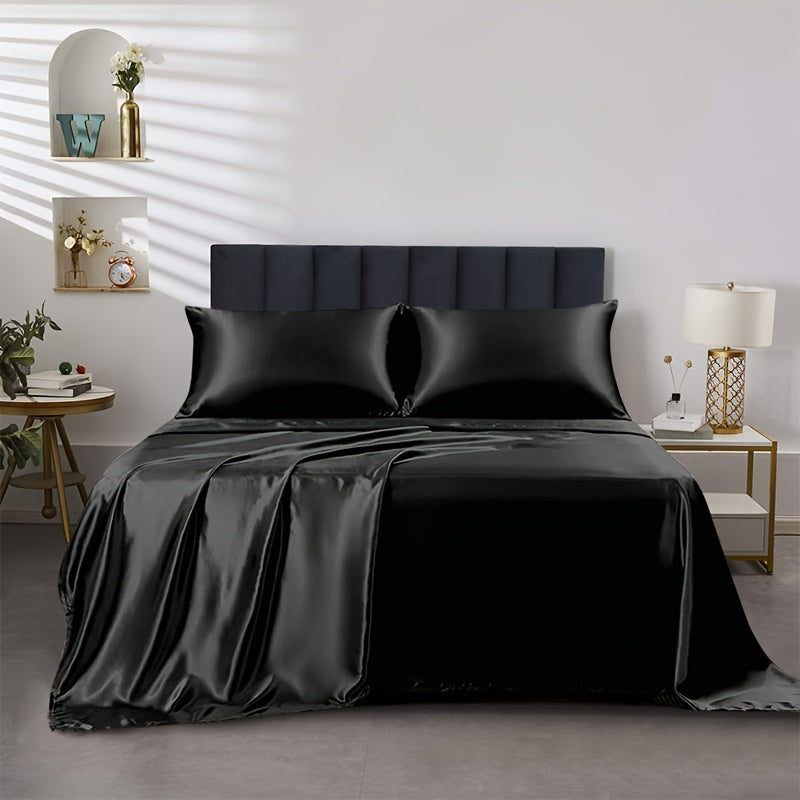 4 pieces of polyester satin solid fitted sheet set includes 1 fitted sheet, 1 flat sheet, and 2 pillowcases, available in Twin, Full, Queen, or King sizes.