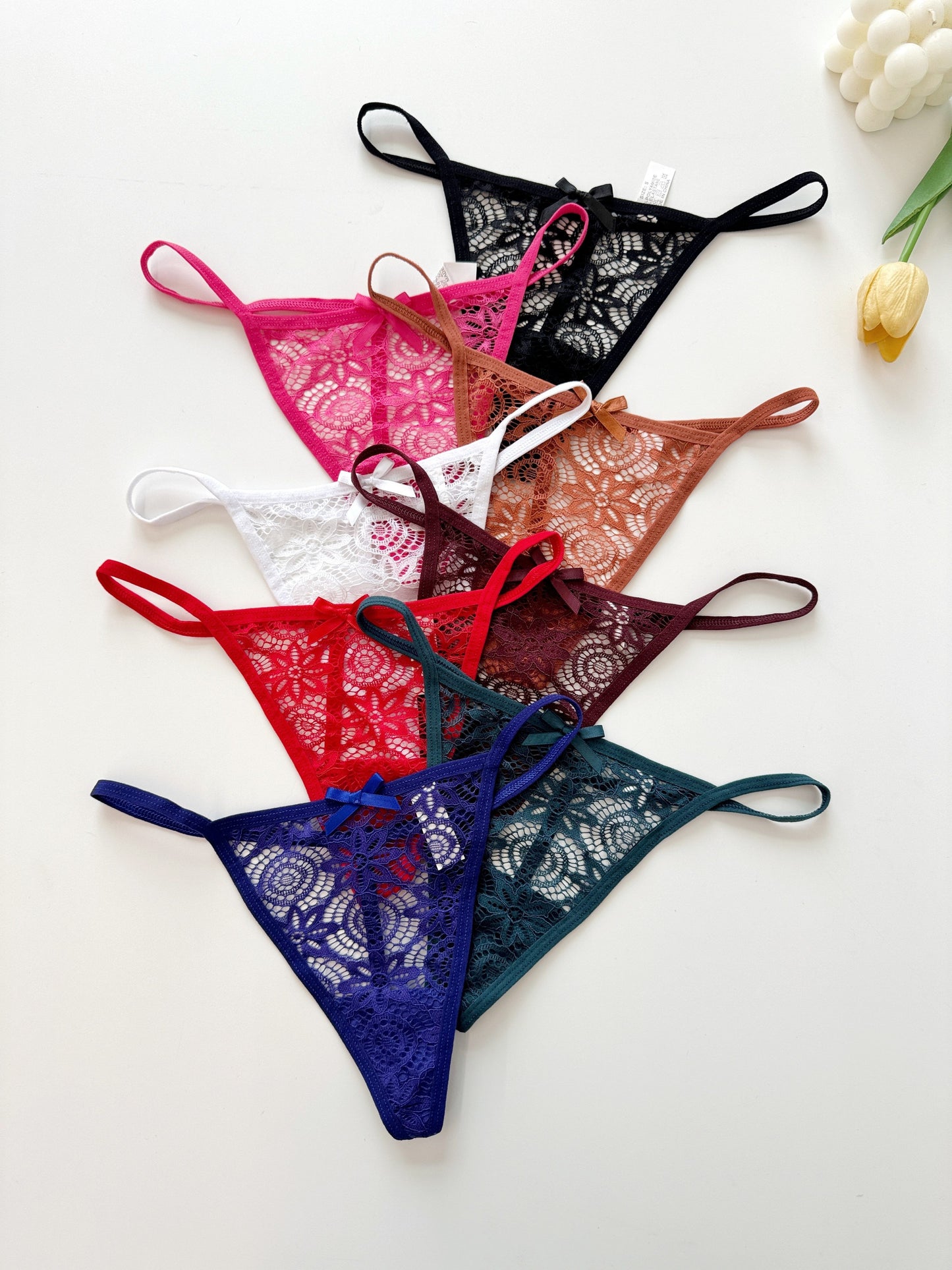 New thin strap low waist thong with lace, bowknot, and see-through design for a comfortable and breathable fit.