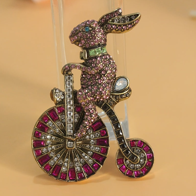 Add a touch of nostalgia with this adorable 1PC Retro Bunny Bicycle Shaped Brooch, embellished with rhinestones. A perfect accessory for women to add to their dress, coat, sweater, or corsage.