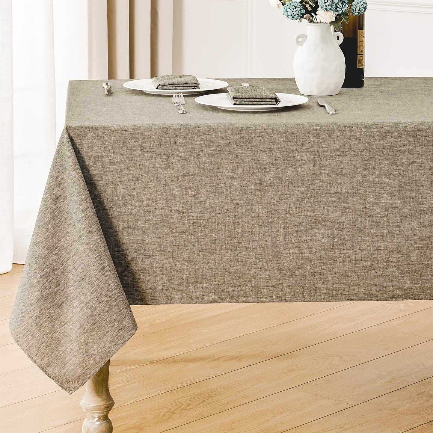 Polyester tablecloth with modern design, ideal for dining room décor.