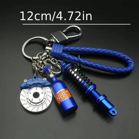 Keychains featuring car parts for car enthusiasts, stylish collectibles including black turbo, silvery gearbox, rainbow tire edges, red brake discs, and red spring shock absorbers. Perfect gifts for boyfriend car lovers.