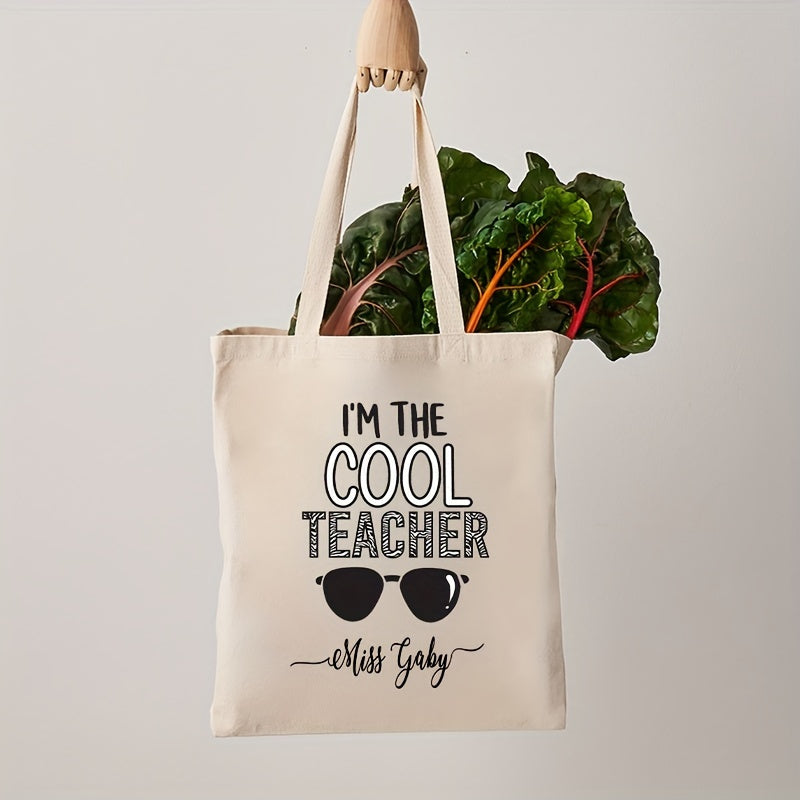 Customized Teacher Shoulder Bag with "I'm The Cool Teacher" Pattern, featuring a personalized name. This stylish canvas shopping bag is perfect for female teachers and makes a great gift for any teacher who loves aesthetic school bags.