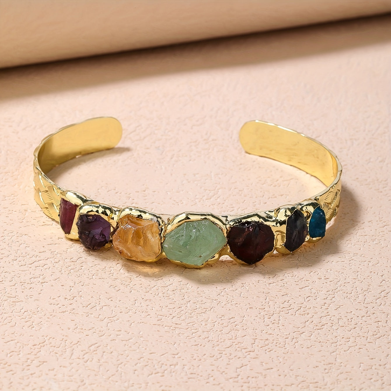 Handmade Bohemian Copper Cuff Bracelet adorned with 7 gemstones, featuring a unique burnt welded design. This beautiful piece showcases a vibrant mosaic of natural rock crystals, making it a perfect accessory for summer parties and Mardi Gras