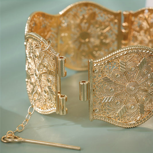 Vintage style gold-tone alloy open cuff bracelet with a hollow carved design, perfect for Arabian weddings. This women's court-inspired accessory makes a great Ramadan gift and is suitable for all-season wear.