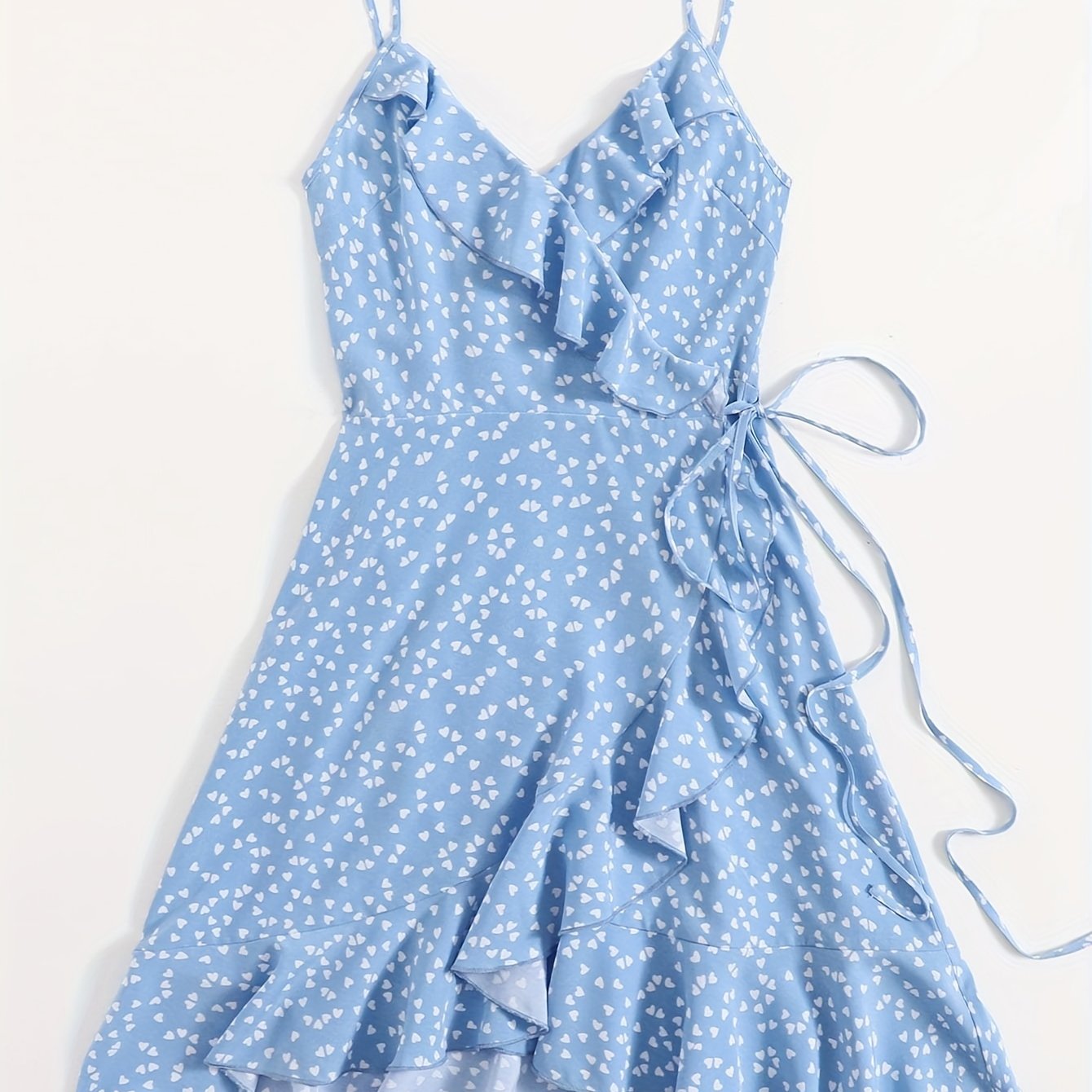 Heart print ruffle cami dress with lace-up detail, sleeveless V-neck design, perfect for spring and summer.