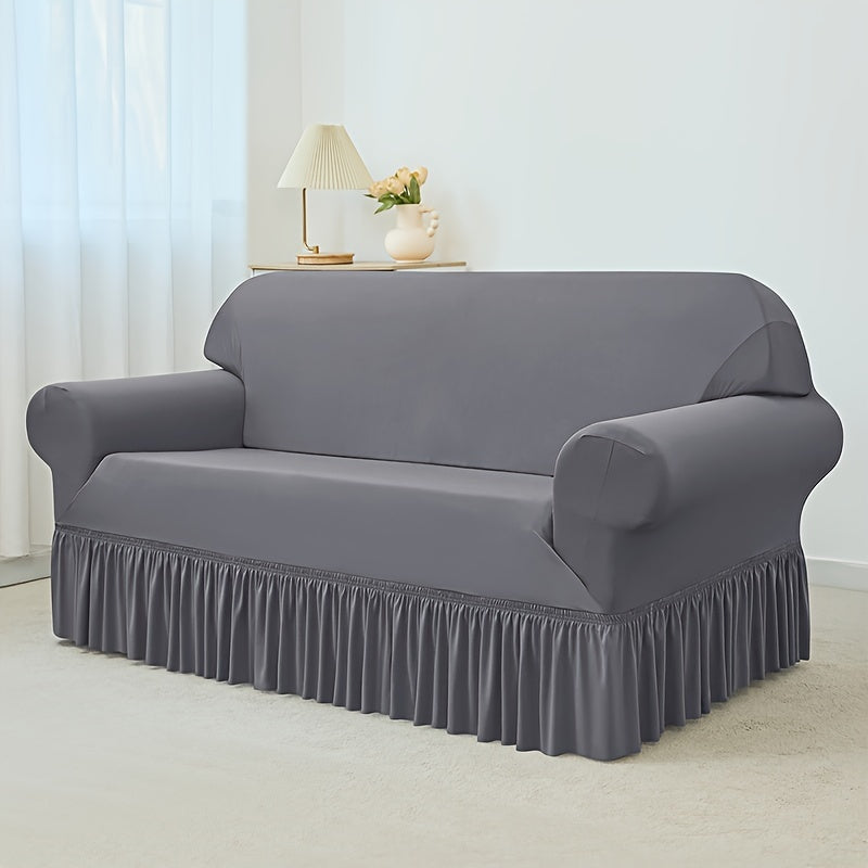 Elastic waterproof sofa slipcover with skirt for all seasons, ideal furniture protection for home and office.