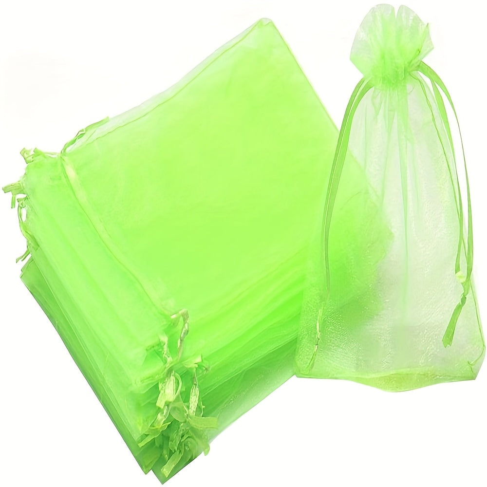 100 green garden netting bags with drawstring for pest protection and plant growth control in fruits and vegetables.