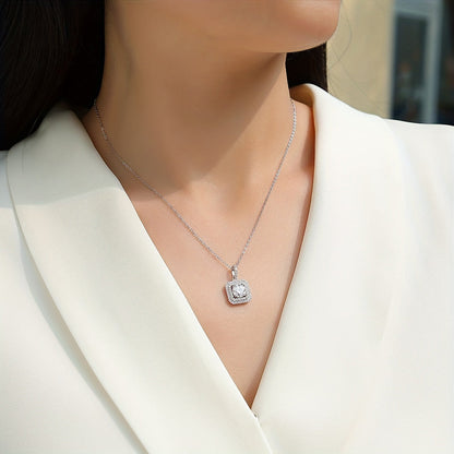 This stylish Moissanite pendant necklace is made of 925 sterling silver and coated with 18K gold, featuring a square halo design. It comes on a collarbone chain and includes a gift box, making it perfect for Valentine's Day, engagements, weddings