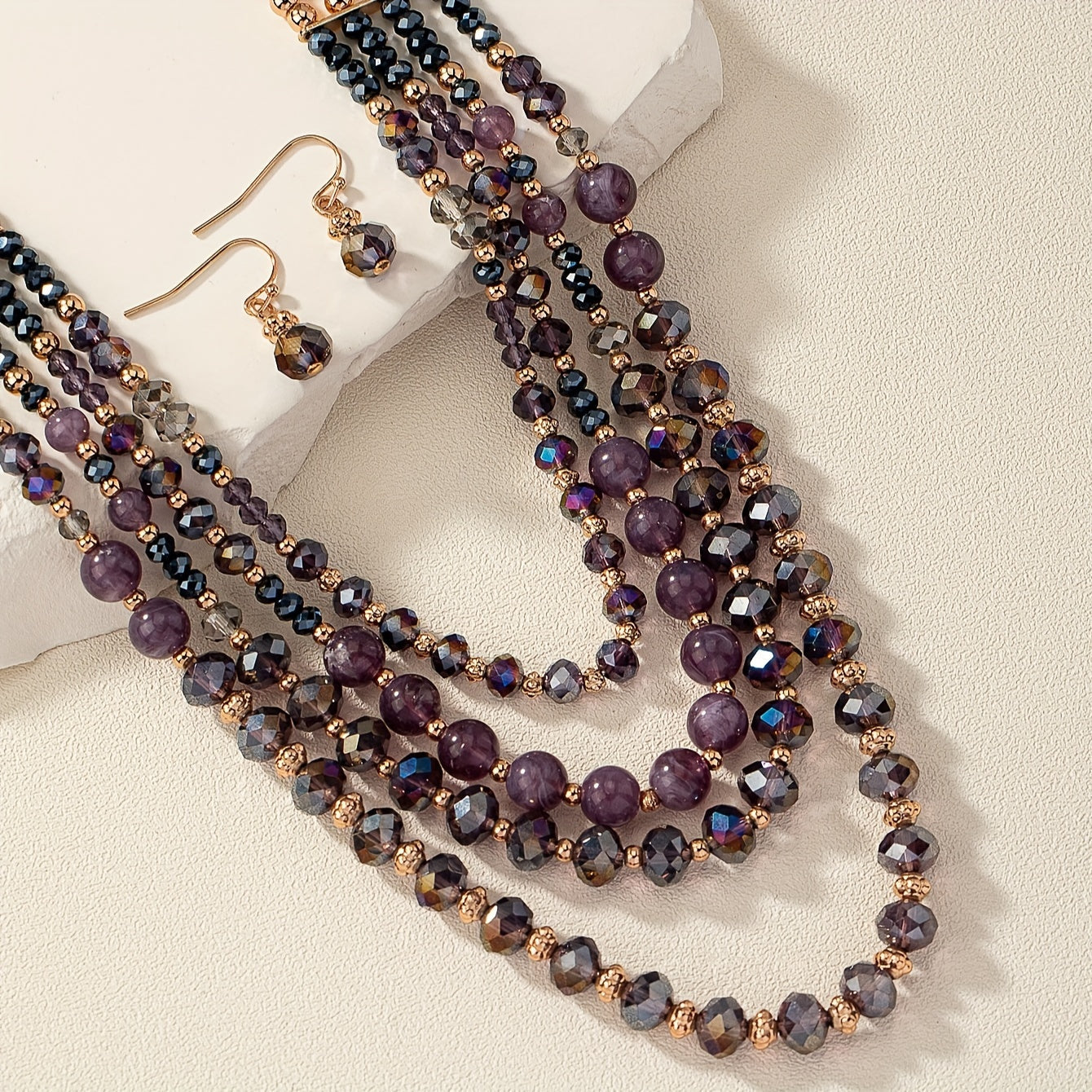 Luxurious and elegant, this Purple Series Beaded Necklace Set exudes style and sophistication. Featuring multiple layers, it is perfect for stacking and adds a touch of glamour to any woman's jewelry collection.