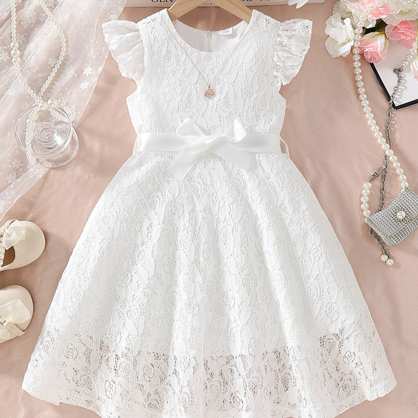 Girls' spring/summer dress with lace detail, belt, and flutter sleeves, ideal for daily wear or birthday parties.