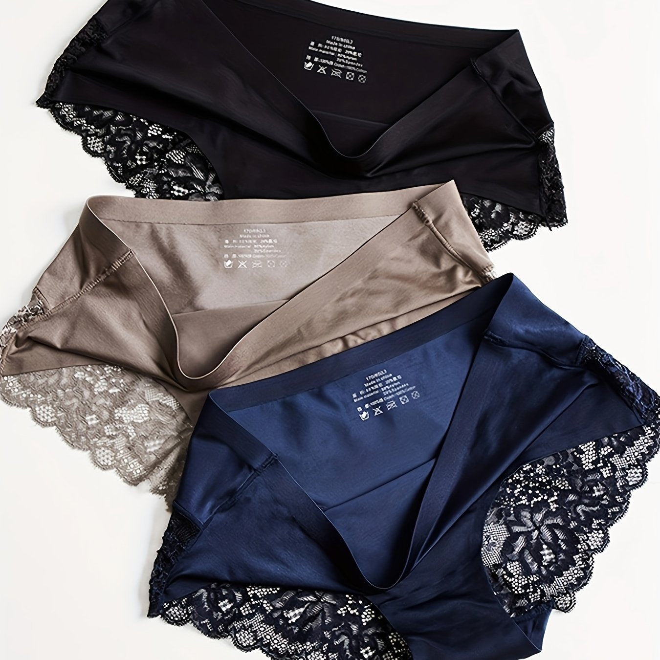 Three comfortable and breathable panties - lace, satin, and smooth lingerie.