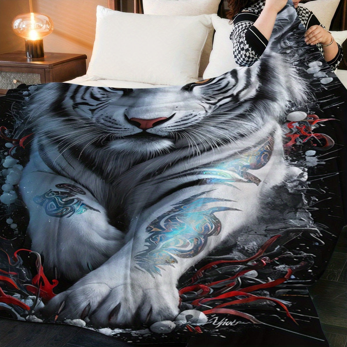 This versatile blanket showcases a stunning white tiger design, exuding artistic creativity and a strong presence. It can be used as a bedspread, towel blanket, nap blanket, or leisure blanket, making it ideal for travel. The soft, lightweight, and