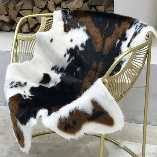 Add a touch of luxury to your space with our 1pc Premium Faux Cowhide Rug. This durable and large size cow print rug is perfect for your bedroom or living room. Made of faux fur, this animal cow hide carpet is easy to maintain with hand washing only.