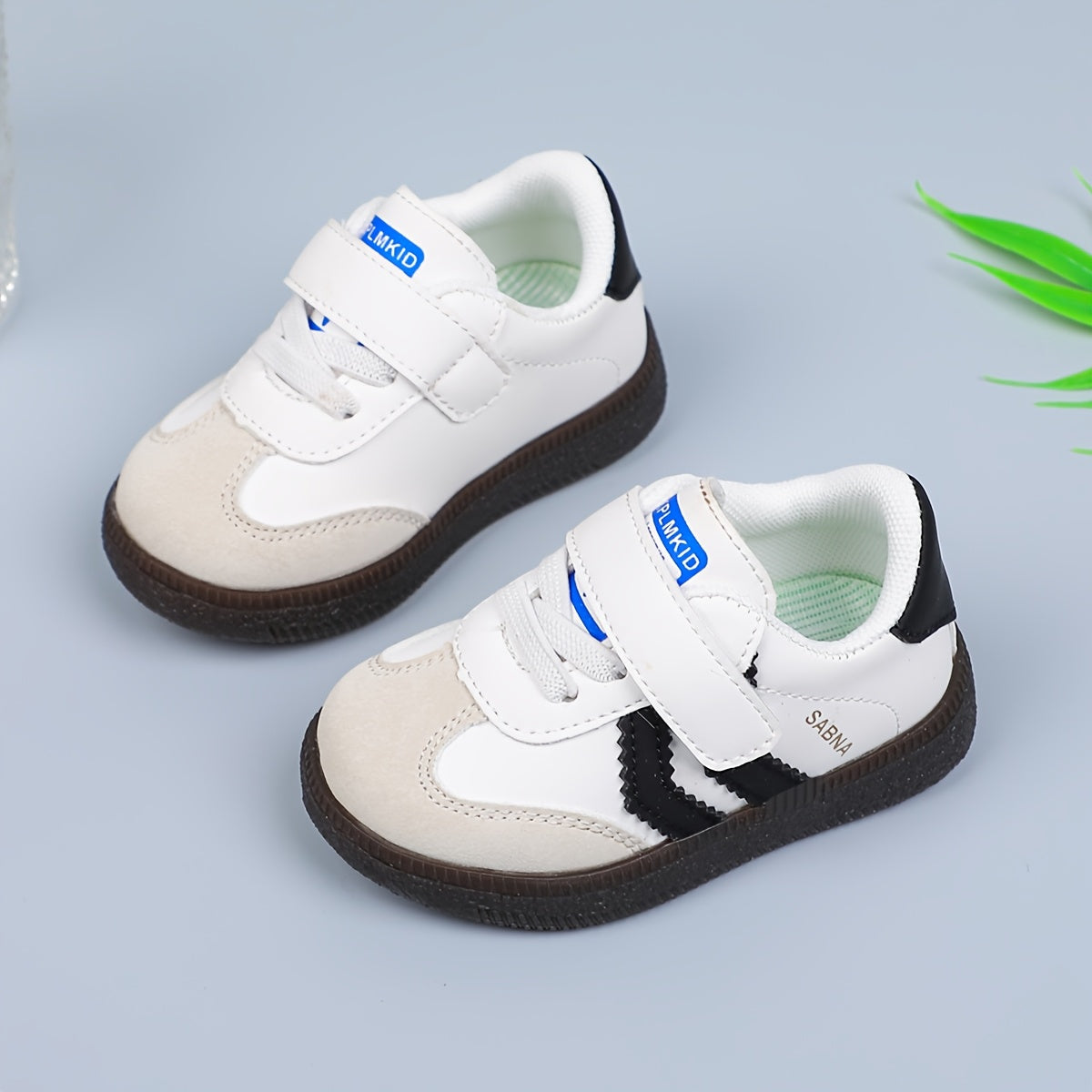 Versatile Boy's and Girl's Casual Sneakers for Spring and Summer. White and black shoes that are comfortable, lightweight, slip-resistant, and stylish for school.