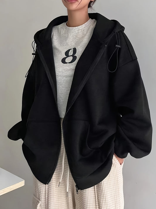 Black zip-up hoodie with fleece lining, long sleeves, loose fit, perfect for fall/winter, machine washable, features oversized hood.