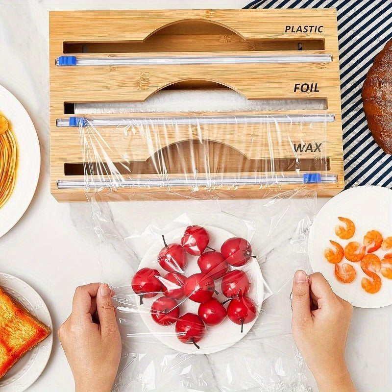 Kitchen organization set featuring a sliding paper cutter and multiple functions. Made of durable plastic, this set includes a foil and wax dispenser, as well as a cherry tomato and orange slicer. Ideal for food wrapping and creating a food wrapping