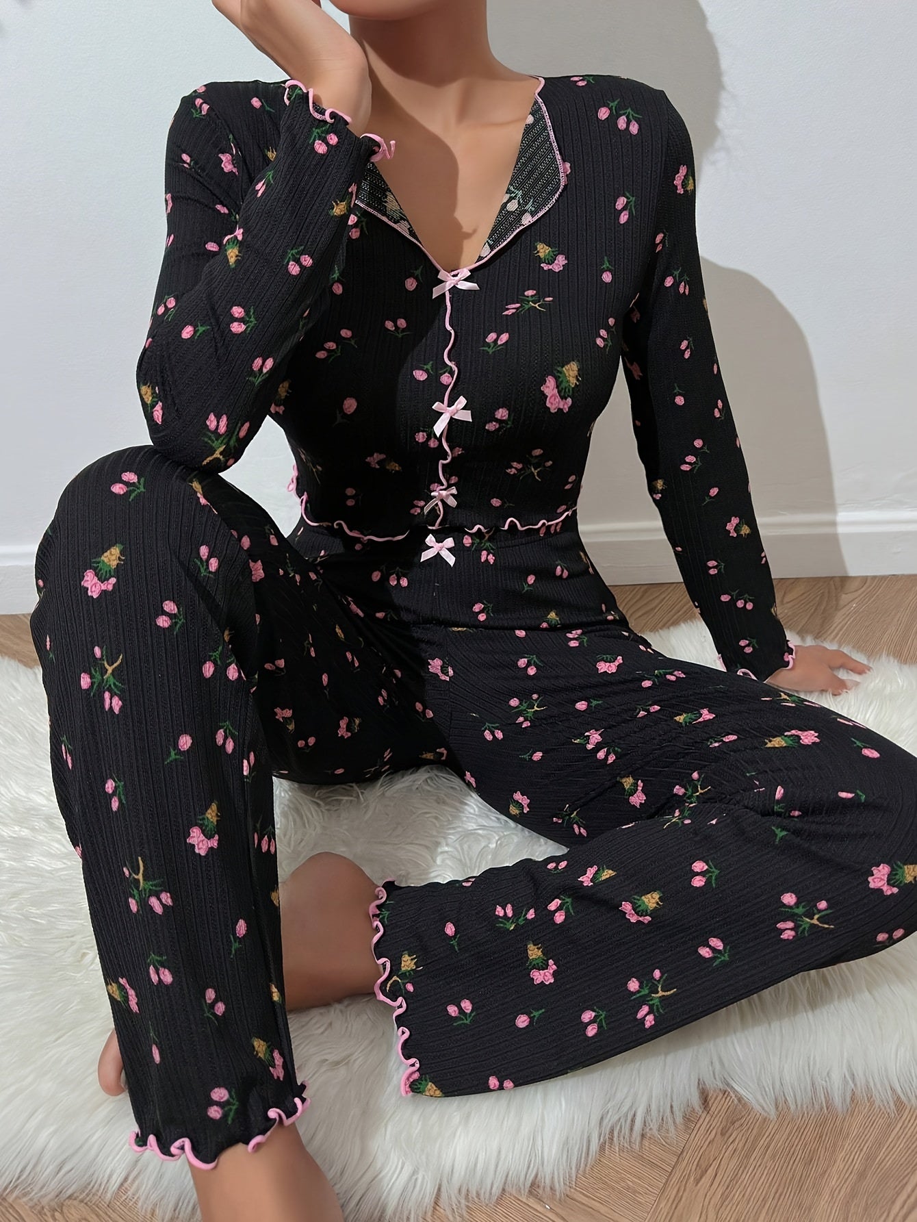 Floral print pajama set with bow detail, long sleeve top and ribbed pants in soft polyester blend - ideal for autumn nights