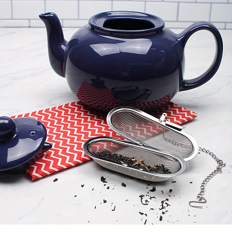 A tea infuser made of durable stainless steel featuring a 304 mesh strainer, perfect for brewing loose leaf tea, spices, and seasonings. This kitchen gadget comes with a convenient chain hook for easy removal from your cup or pot.