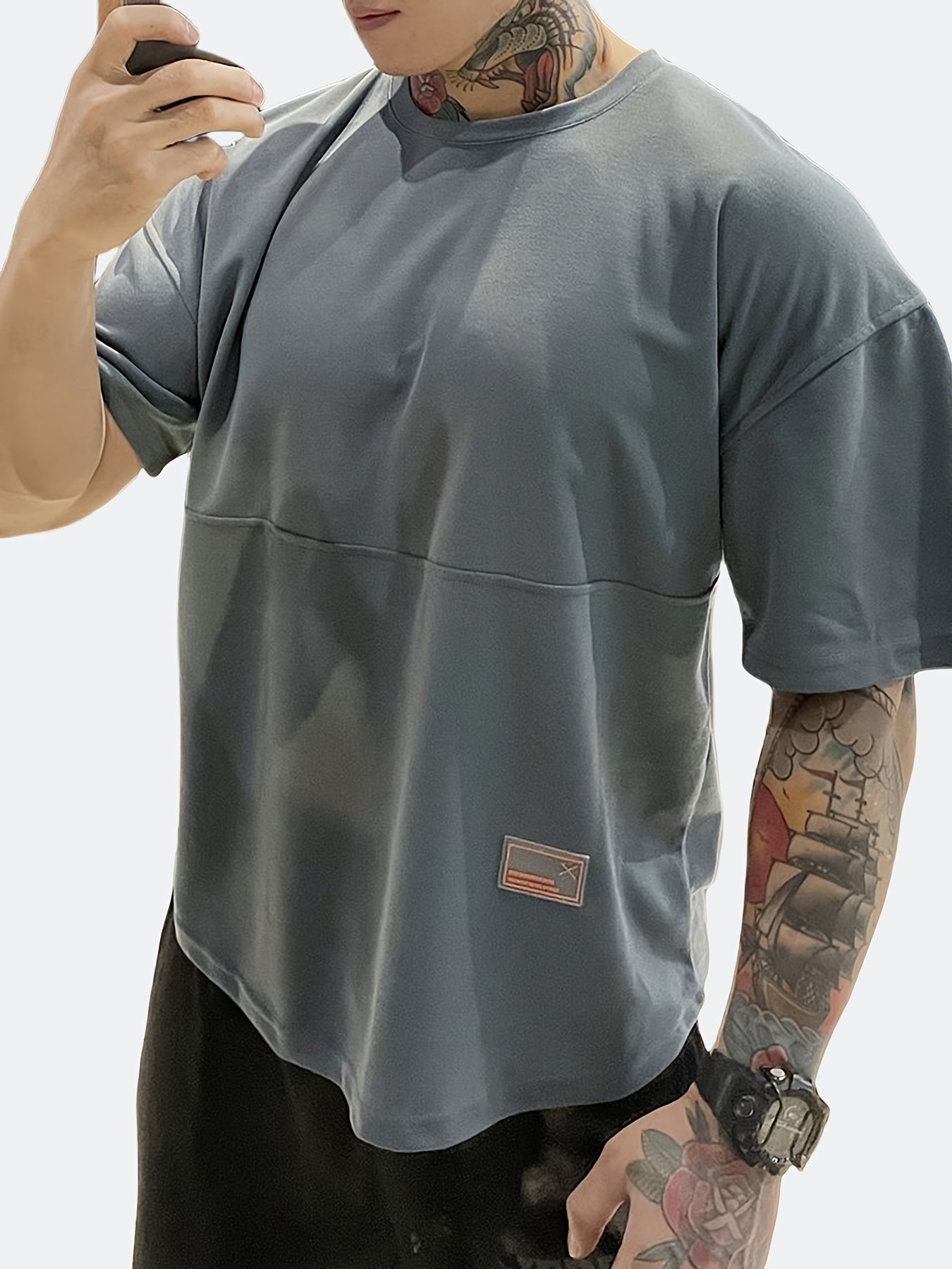 Men's casual sports T-shirt with round neck, short-sleeved, versatile for outdoor activities.