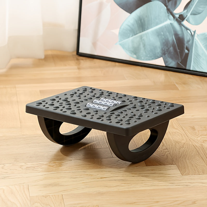 Ergonomic black under-desk footrest with adjustable plastic leg support for office and home comfort.