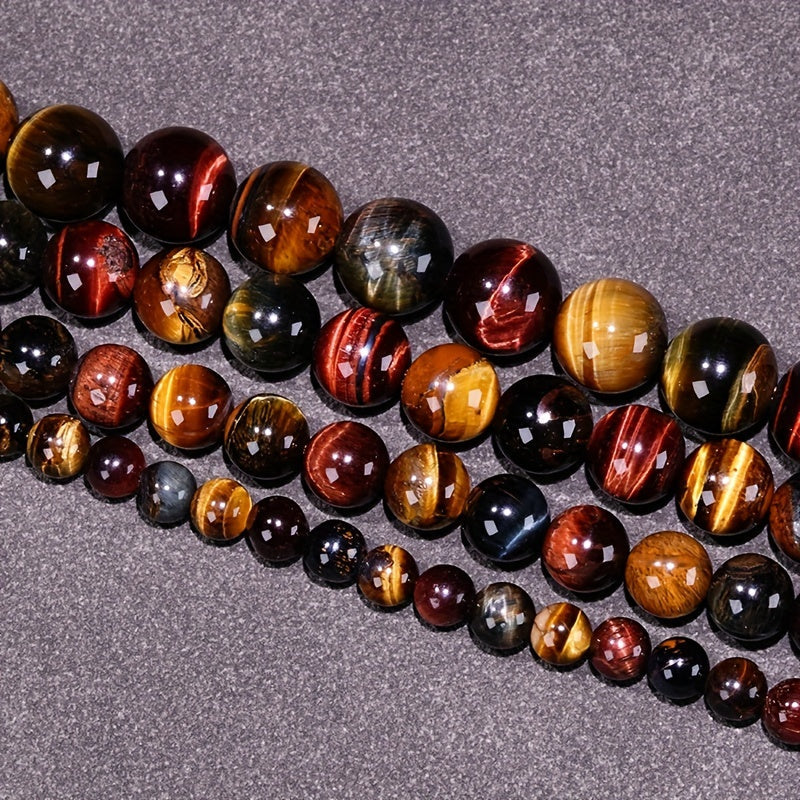 Loose round beads made from natural three-color Tiger Eye stone available for wholesale. Perfect for creating semi-finished DIY jewelry such as woven bracelets, necklaces, and sweater chains.