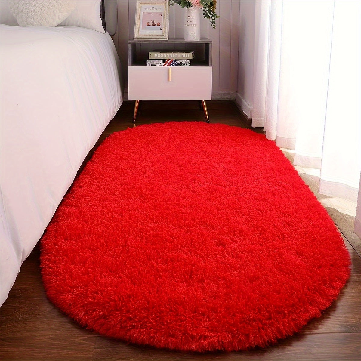 Soft and fluffy oval shaggy area rug, perfect for bedroom or living room. Made with skin-friendly thickened sponge and tufted polyester material. Durable and easy to maintain. Adds decorative touch to indoor spaces such as sofa, bedside, playroom, or