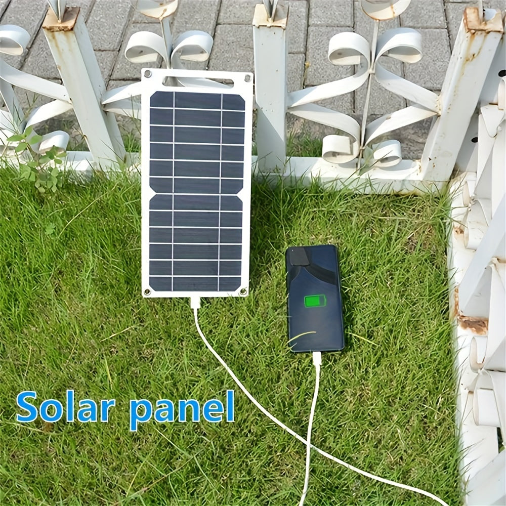 Compact dual USB solar charger, perfect for camping and home use.