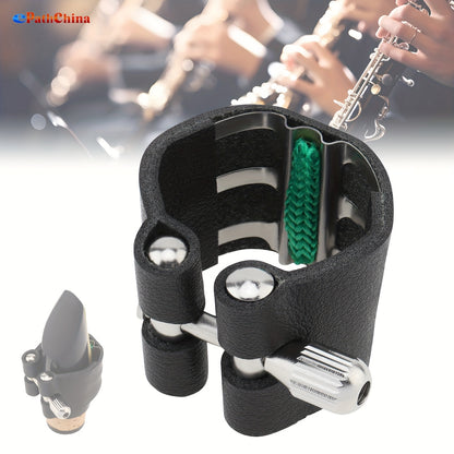 Black faux leather clarinet ligature with adjustable screws and shock-absorbing fastener for B flat clarinet.