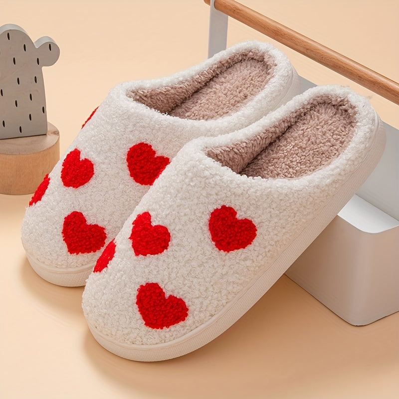 Cozy slip-on slippers with cute heart pattern, plush lining for indoor comfort.