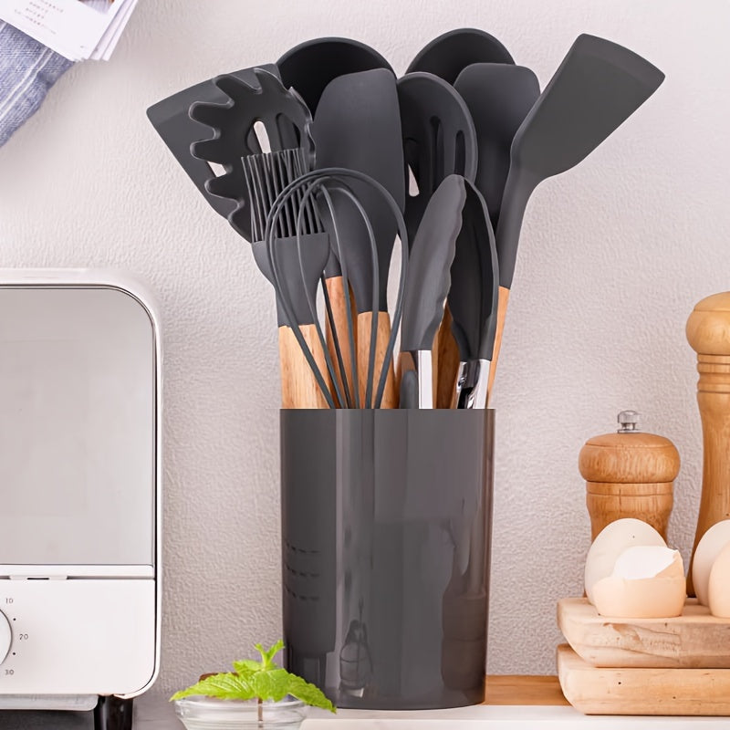 A bundle of 12 high-quality kitchen utensils with wooden handles and heat-resistant silicone heads, including cooking spatulas and spoons. Comes with a convenient storage bucket for easy organization. Built to last and suitable for any cooking task.