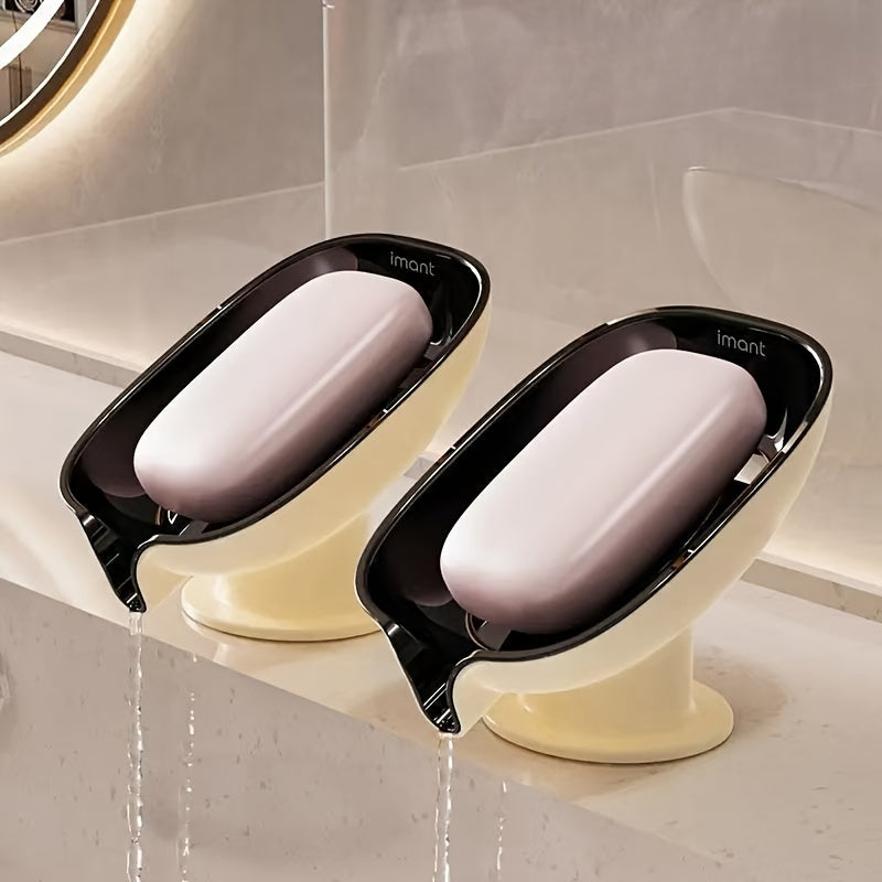 Durable plastic oval soap dish with an elegant, self-draining design for bathroom use.